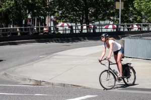 Bicyclist_Crossing_the_Street-300x200